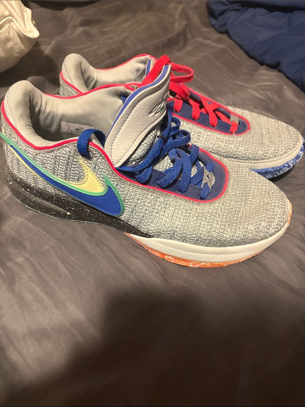 Nike Kids Gray Sneakers with Blue Laces and Yellow-Green Swoosh